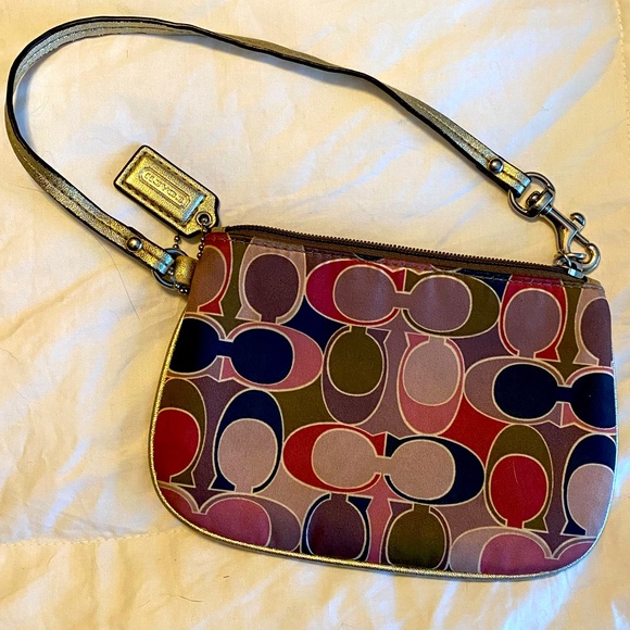 Coach Handbags - Coach wristlet multicolor with pink interior